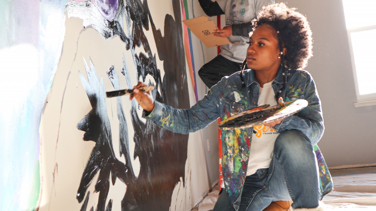 Wilmington’s Youth contributes to Teen Warehouse by painting a mural